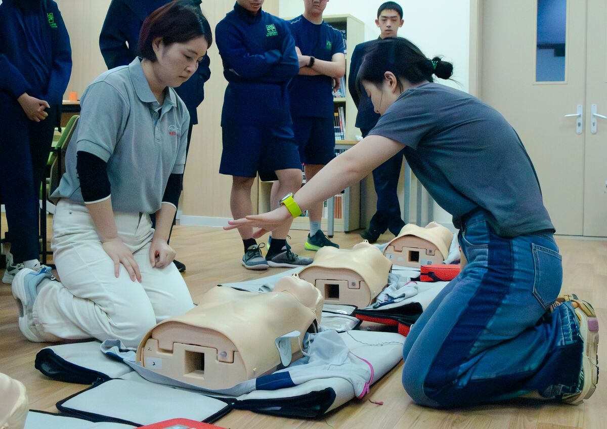 Students practicing first aid together